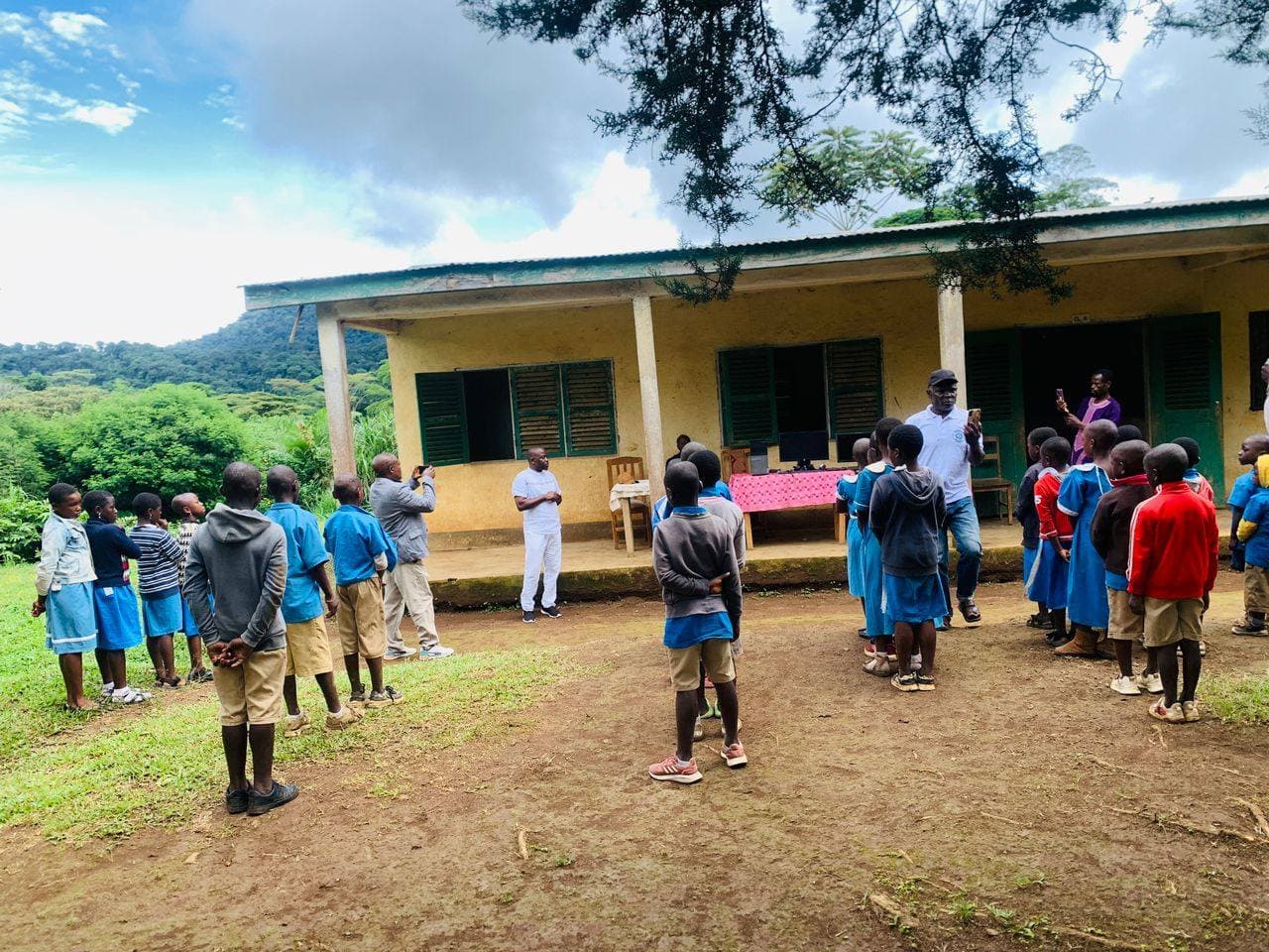 Pupils gathered outside the community school building