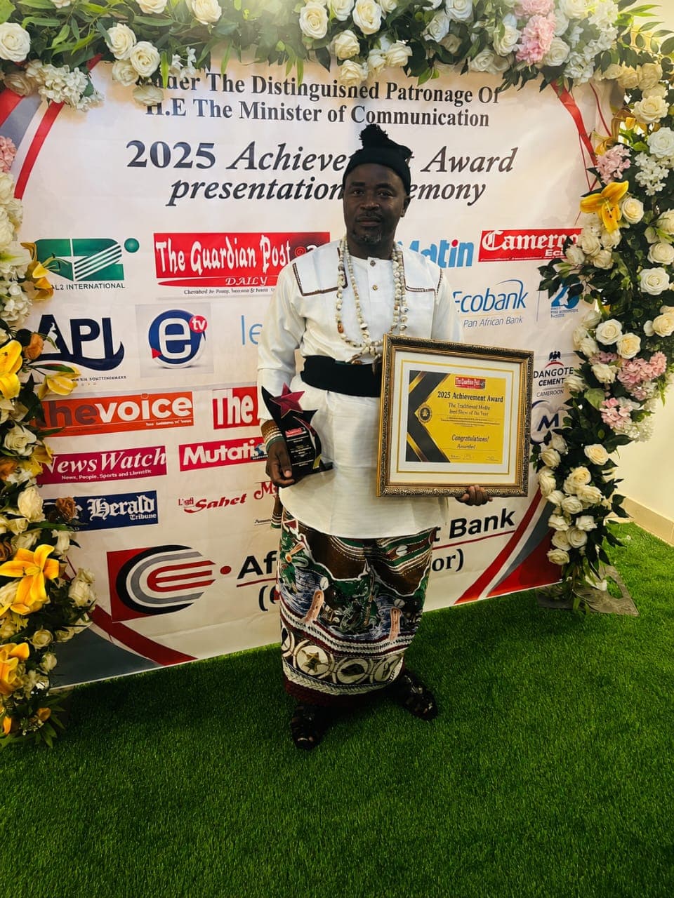 Dr. Akule Akale Ransom Sone receiving the 2025 Achievement Award as Community Development Champion from The Guardian Post