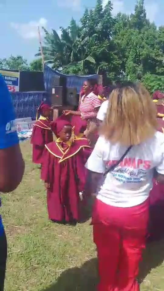 Pupils in graduation gowns at UBINAPS prize day